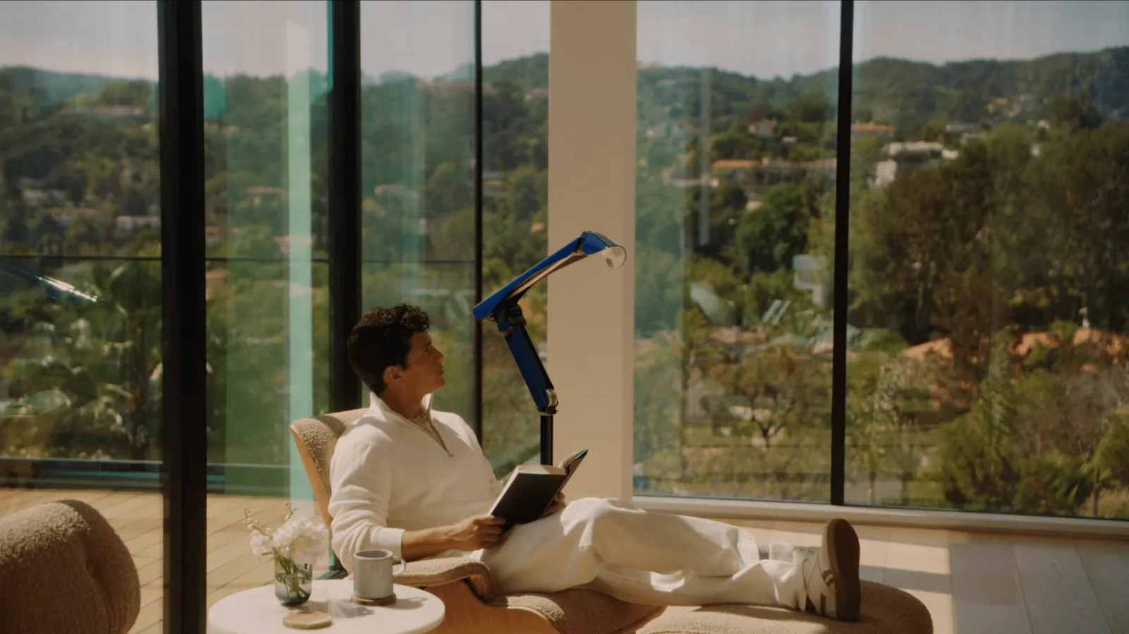 Syncere Lume furniture robot shown in a living-room setting where a lamp-like home robot can stay useful while idle